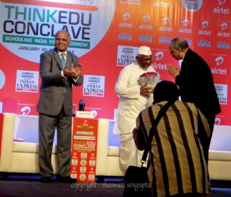 Anna Hazare receiving bouquet from The New Indian Express group